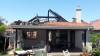 Extensive roof and wall damage due to fire- house uninhabitable