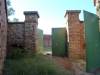  Interior of the triangular tenaille protecting the entrance of Fort Wonderboompoort in the current Wonderboom Nature Reserve, Pretoria. The stout, interior and exterior armour-plated steel doors of the double entrance gateway are visible at middle and right respectively: May 2013