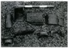 Cast iron stove fragments. Note design on center left piece. Scale 50cm